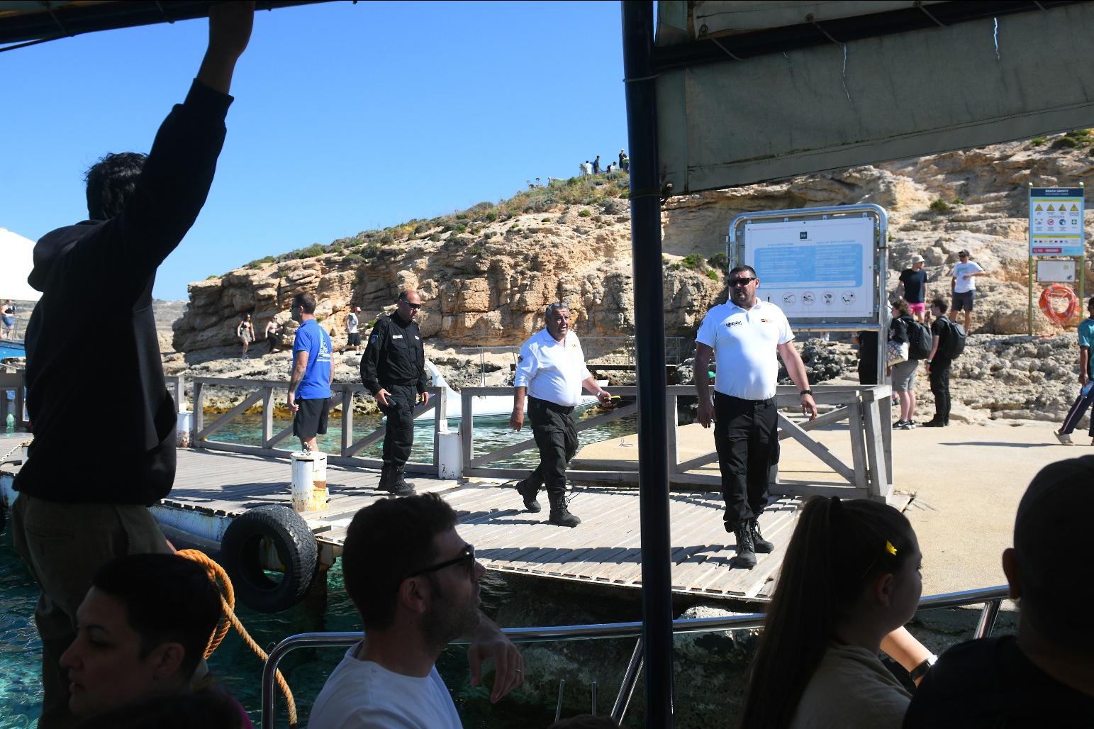Transport Malta officials greeting visitors to Blue Lagoon.