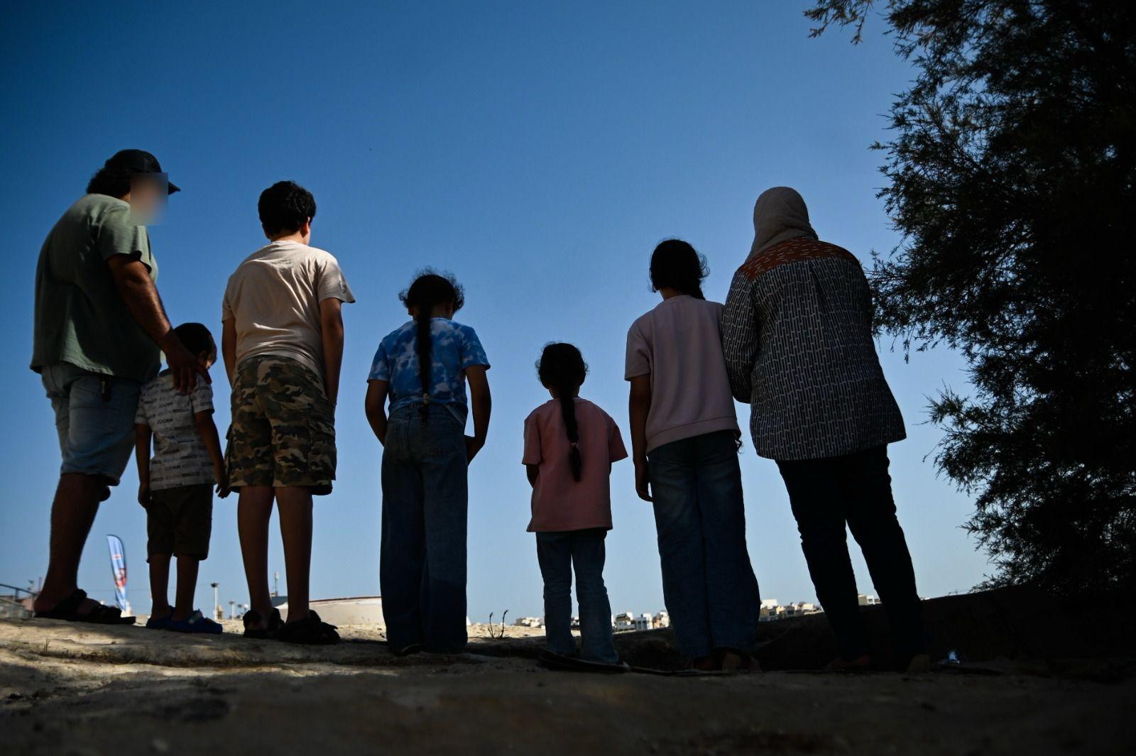 The family, pictured together as they face another night without a roof over their heads. Photo: Jonathan Borg