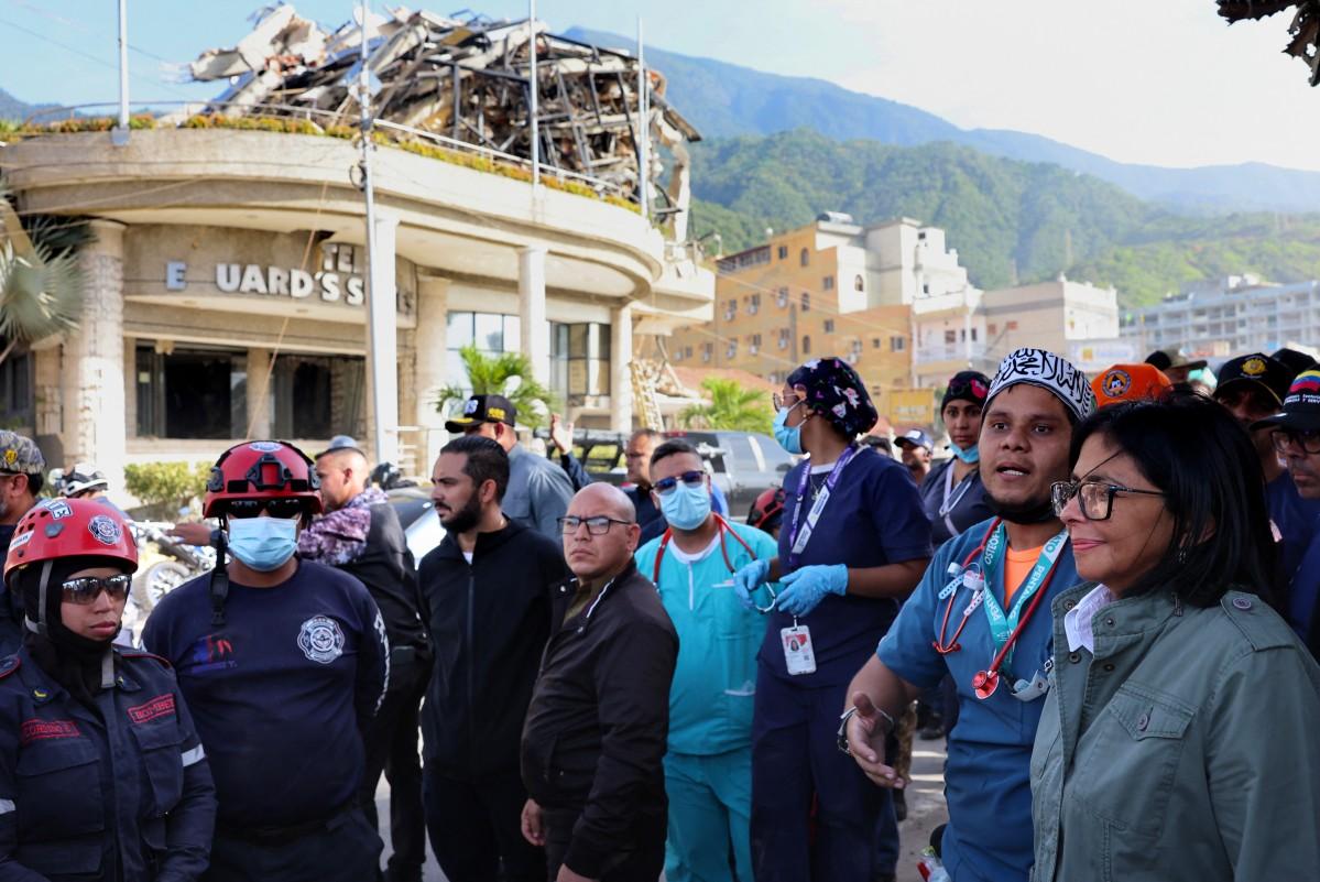 Handout picture released by the Venezuelan presidency press office showing Venezuela's interim President Delcy Rodriguez (R) visiting the area strongly affected by the earthquake in La Guaira, some 35km north of Caracas on June 25. Photo: AFP