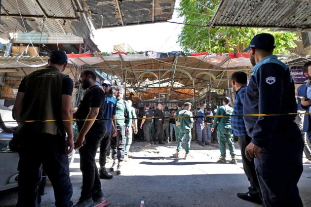 Bomb blast at Damascus cafe kills nine, authorities say