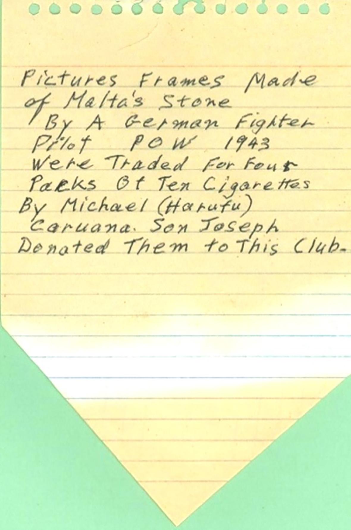 The note with the crucial information attached to one of the photo frames.