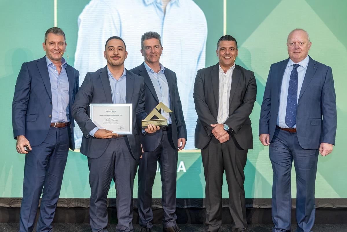 Jake Taliana, Star Letting Consultant, receiving his award for outstanding performance in 2025.