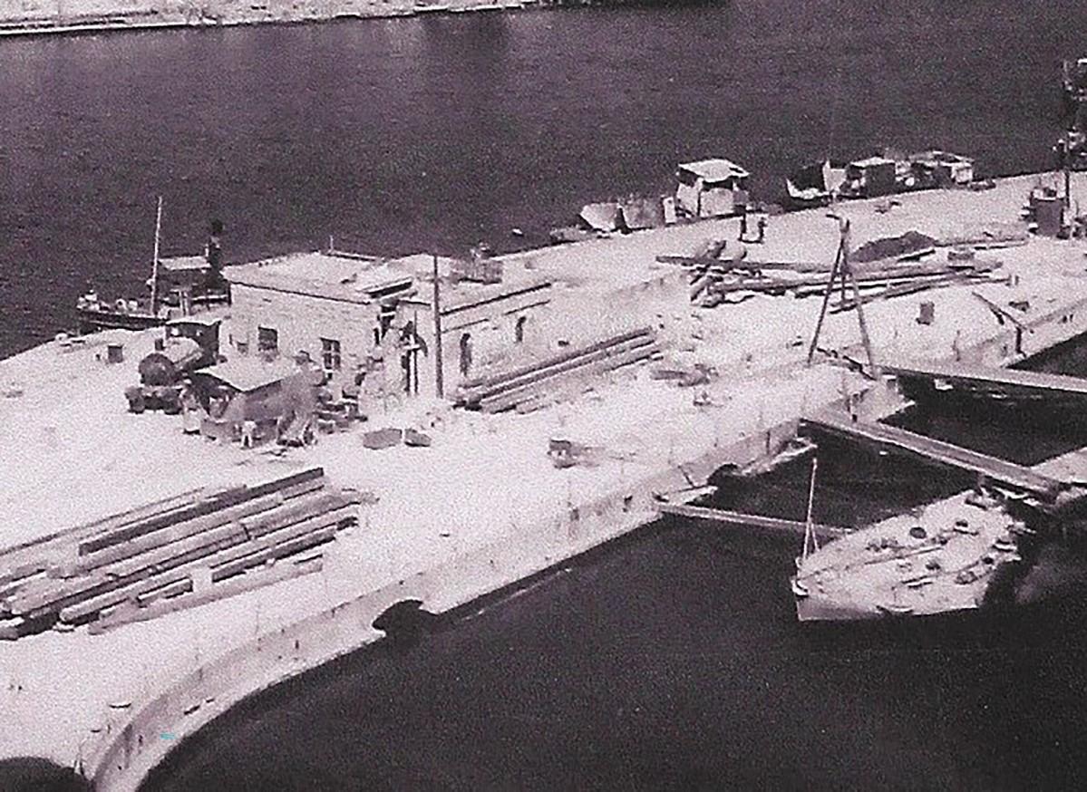 A rare image of one of the elusive Dockyard locos (at left) on Hamilton Wharf.