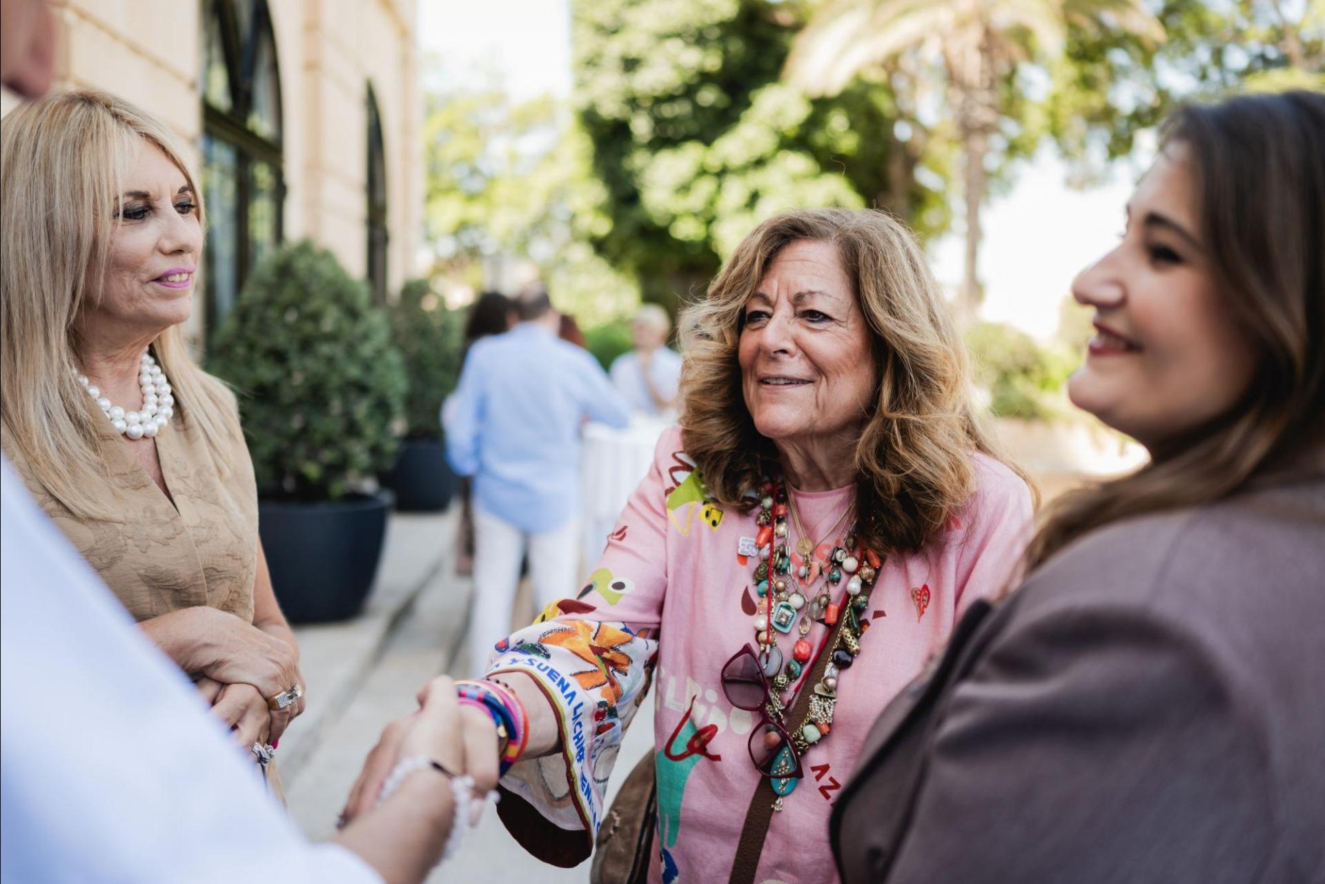 Fern Mallis meeting guests at the event.