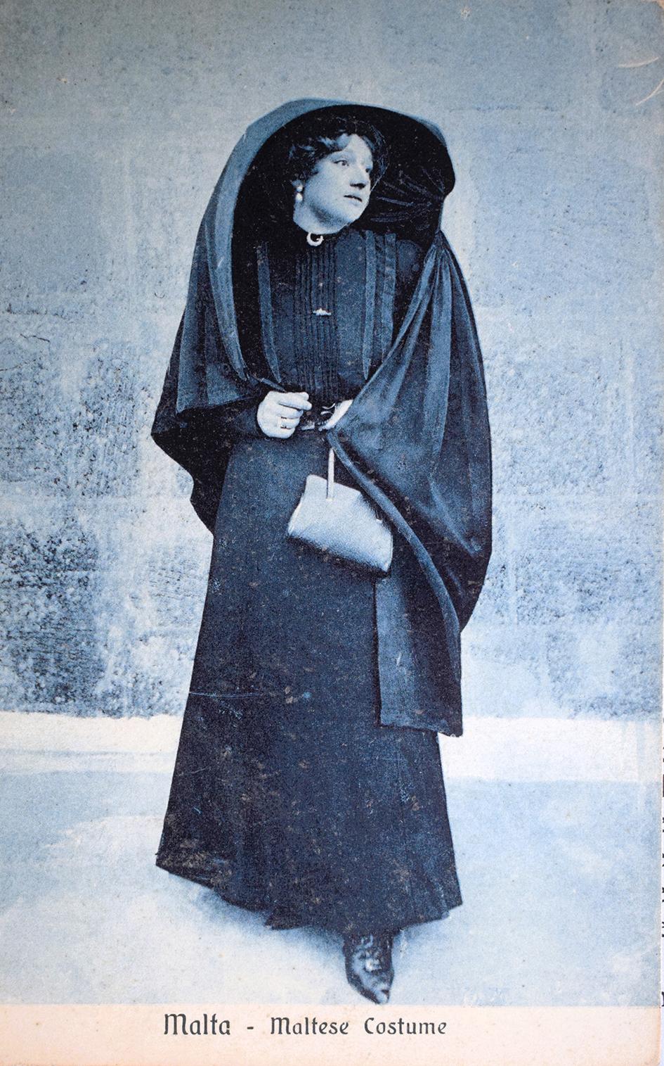 A Bonello postcard of a &lsquo;Lady in Għonnella&rsquo; in the blue Art Magazine set.