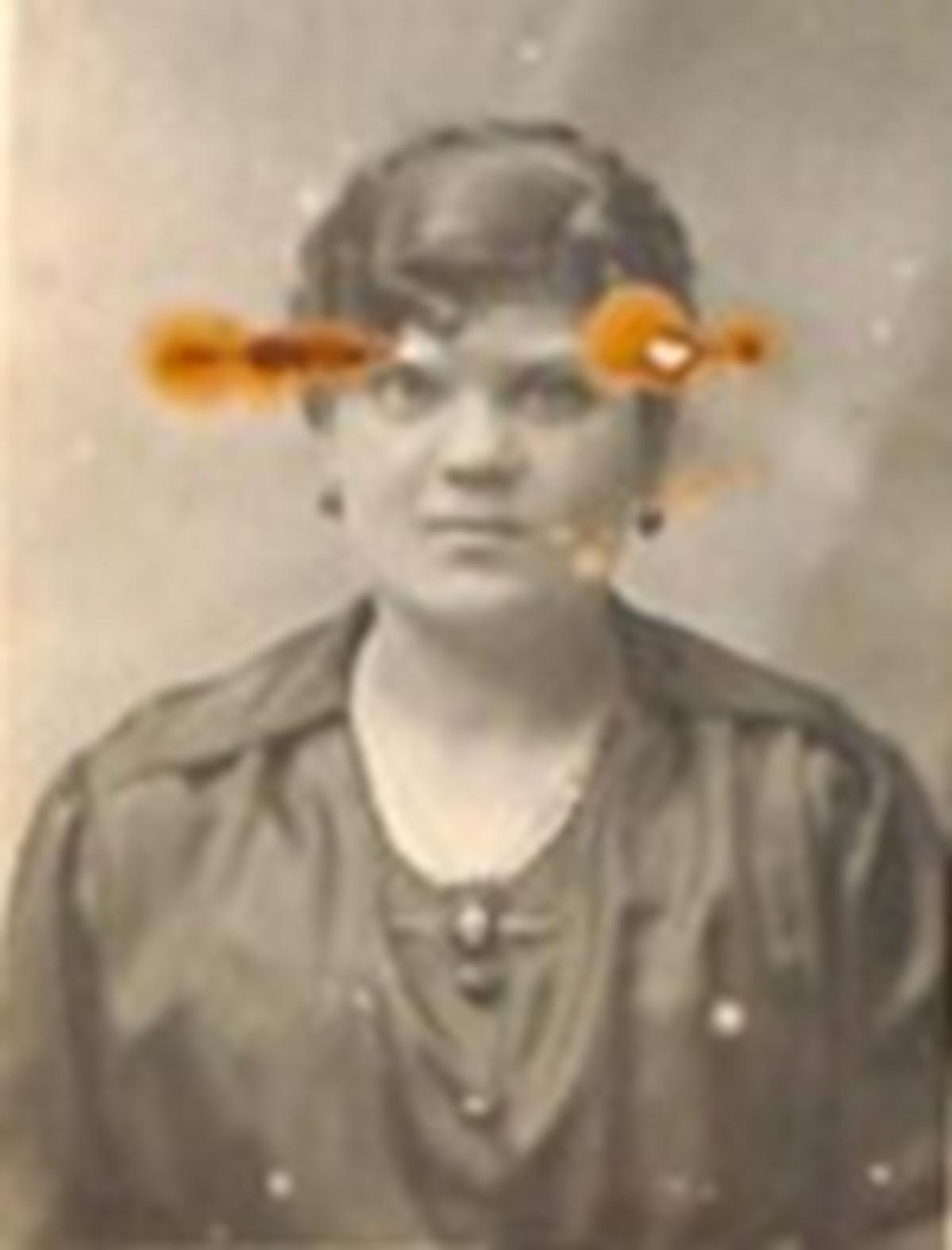 Rosaria Falzon, 1920 passport photo. Note the rust from the iron pin that attached the photo to the passport application.
