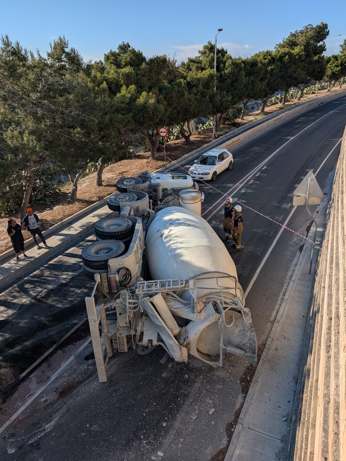 The truck blocking the road after it flipped over. (Chris Sant Fournier).