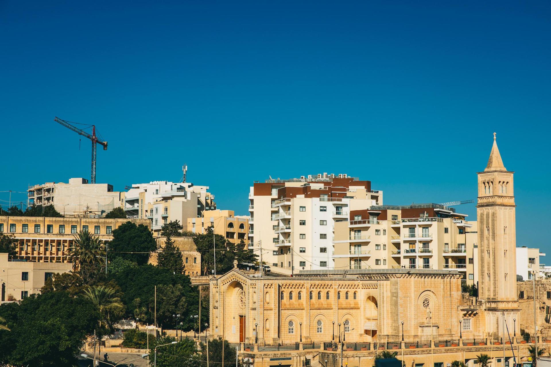 Tower cranes and new developments rise in Marsascala. Photo: Darrin Zammit Lupi