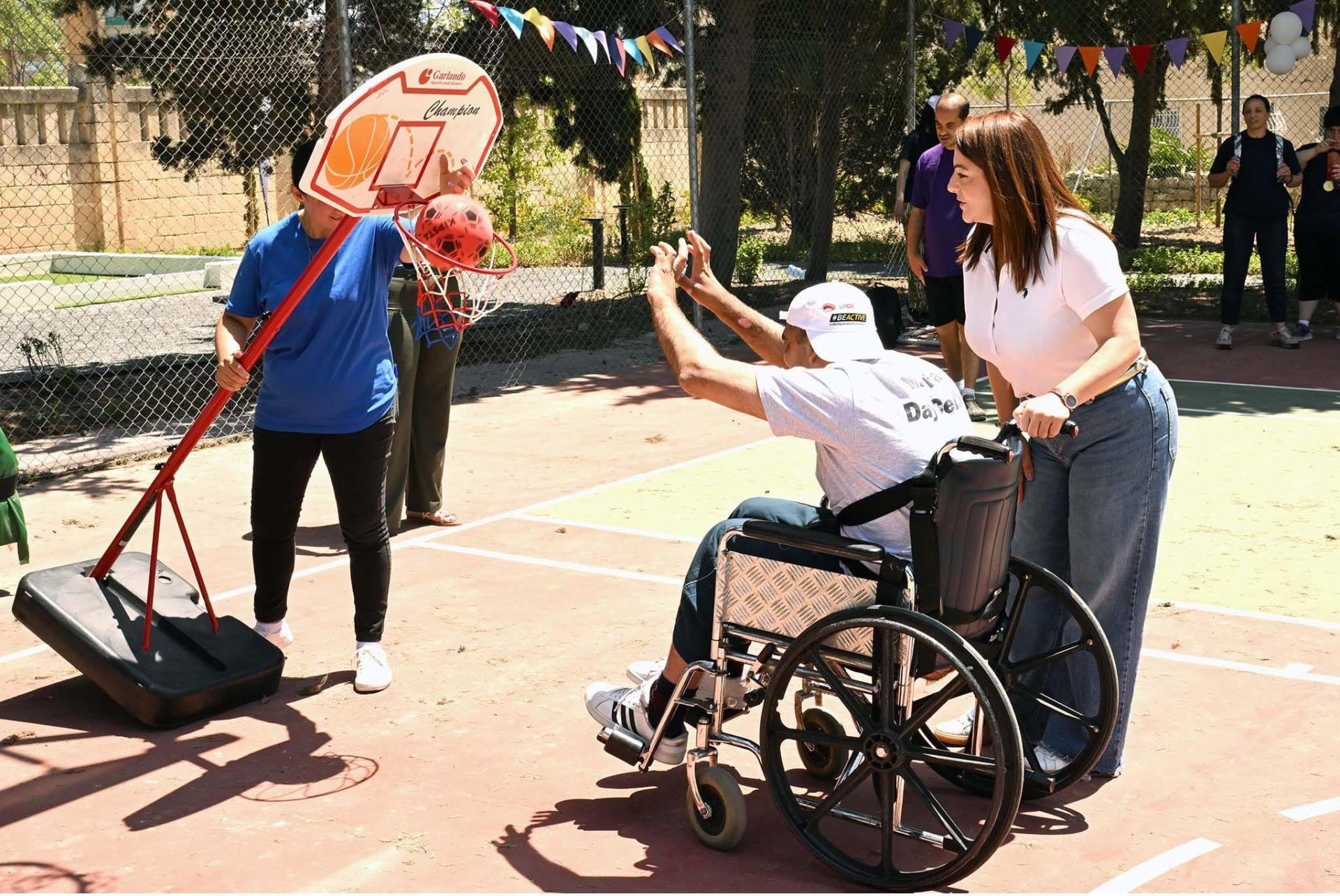 Minister Julia Farrugia with one of the day centre attendees. Photo: DOI/Pierre Sammut