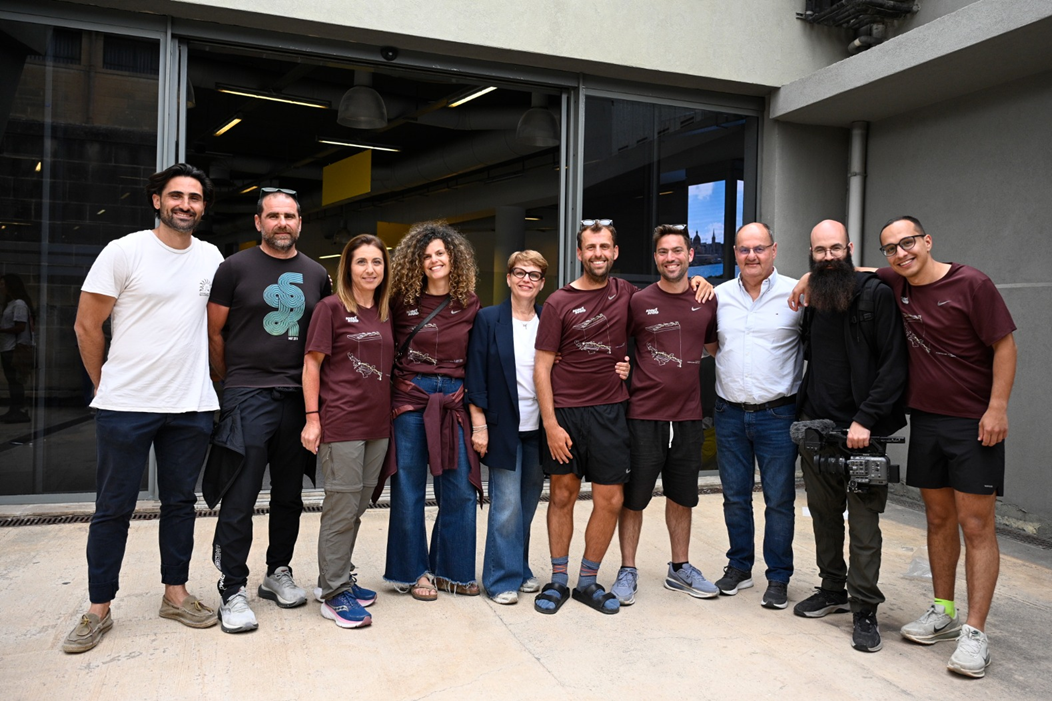 Zach Vella (middle) surrounded by his crew, friends and family members as he arrived in Malta. Photo: Matthew Mirabelli