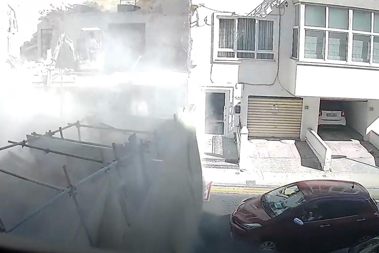 A digger on the site appears to have pushed the scaffolding into the path of an oncoming car. Video: Times of Malta reader