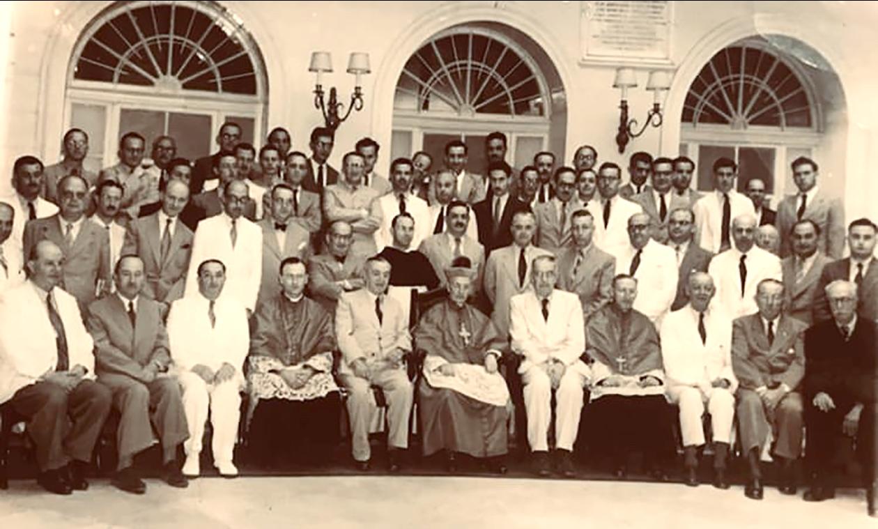 Group photo of the 1946 ceremony marking the merger of the Anglo-Maltese Bank and the Banco di Malta to form the National Bank.