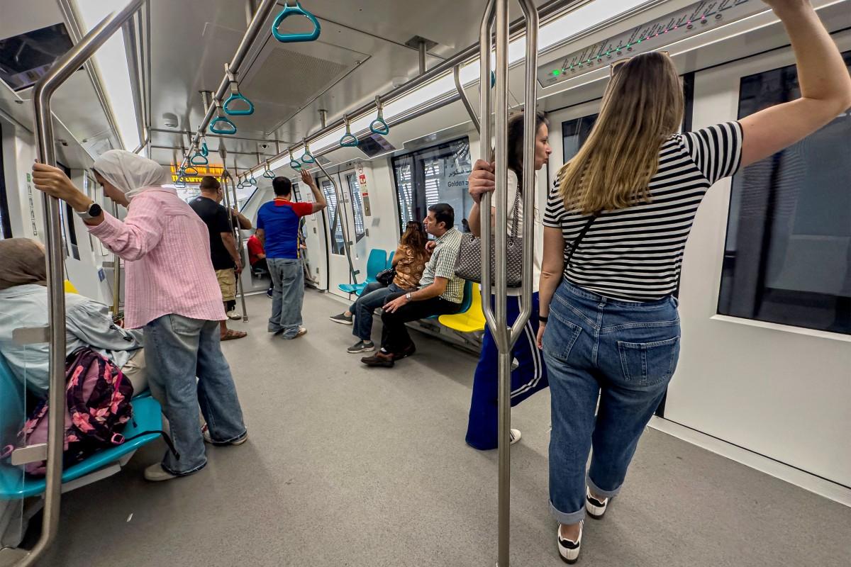 Passengers ride aboard the new Cairo Monorail as it moves through the Fifth Settlement, a neighbourhood of the New Cairo suburb of Cairo, on May 22. Photo: AFP