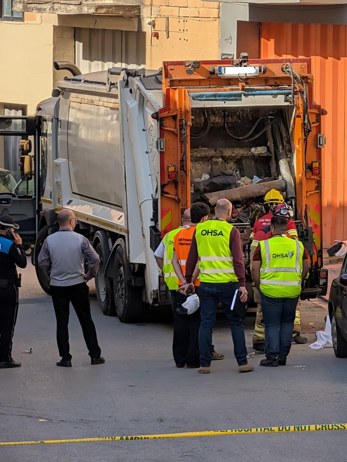 Investigators at the back of the truck where the accident happened. Photo: Chris Sant Fournier.