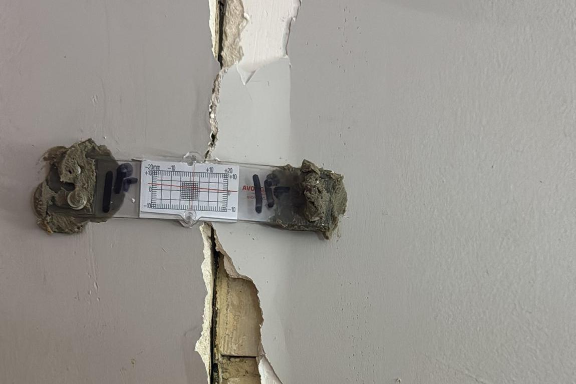 A gauge given to the residents to measure the cracks opening in their walls.