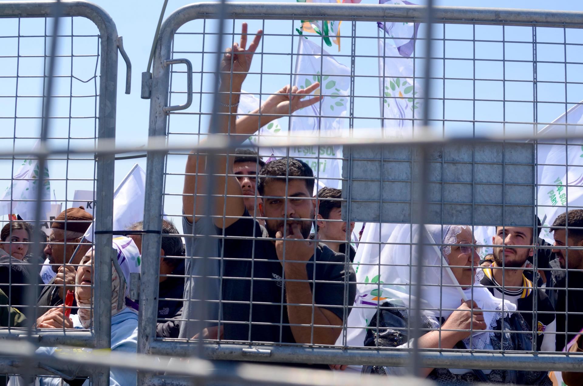 Supporters at a final rally of the Yeşil Sol Parti final rally, separated from the stage by police barriers. Photo: Mina Tolu