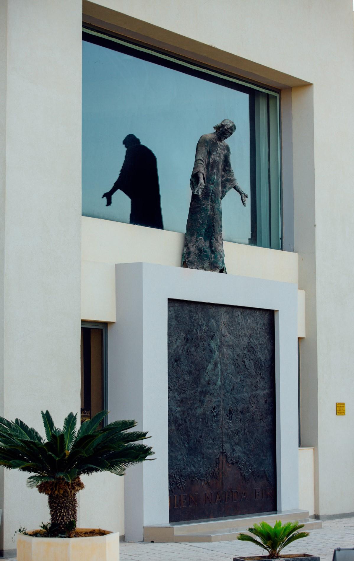 The welcoming Christ greets visitors even before they cross the church threshold.