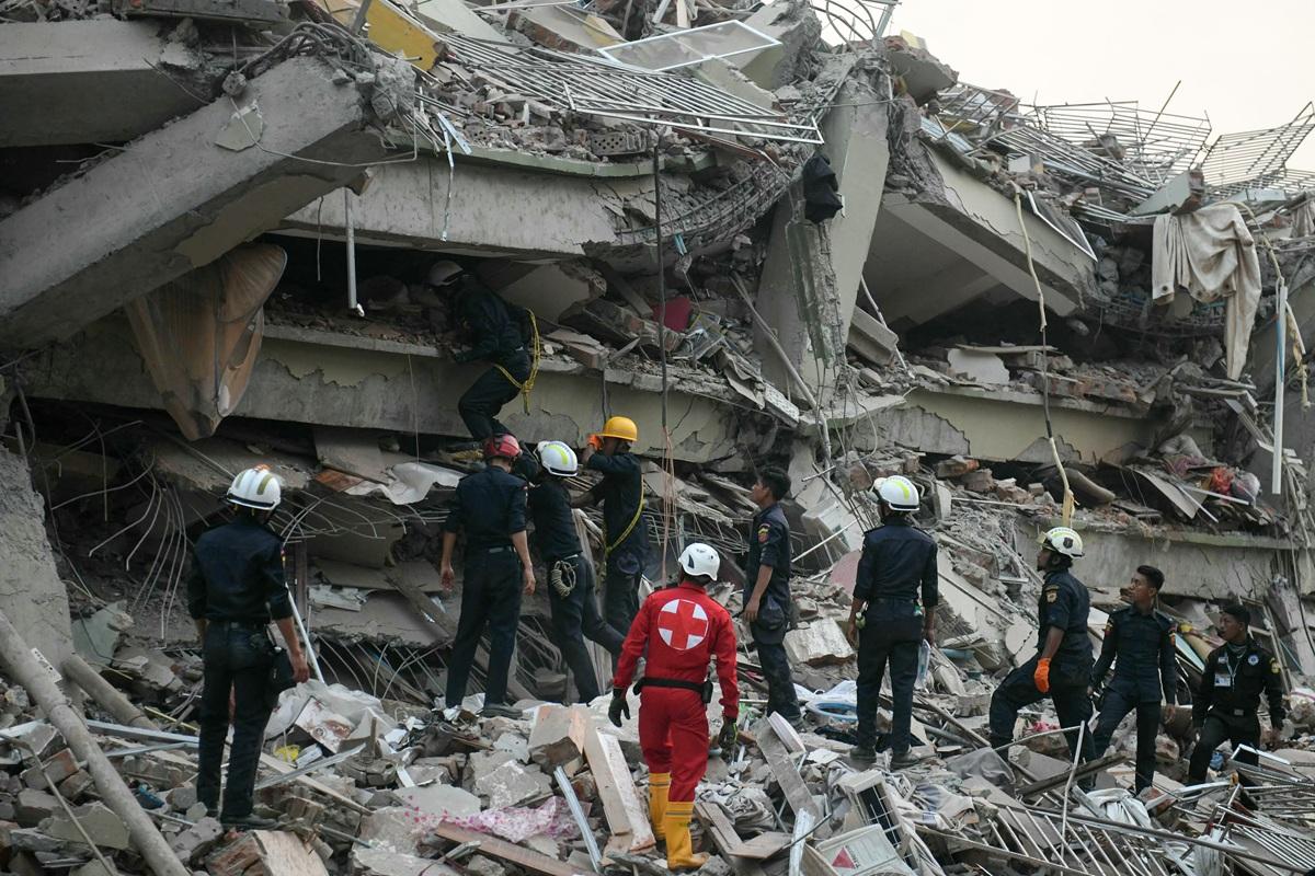 Rescuers search for survivors trapped in the collapsed Sky Villa Condominium in Mandalay. Photo: AFP