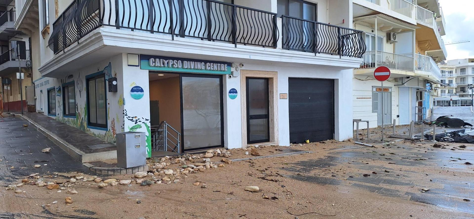 The beach appears to have relocated right outside the Calypso Diving Centre in Marsalforn, as big waves moved sand and stones right outside its doorstep. Photo: Facebook/ Calypso Diving Centre