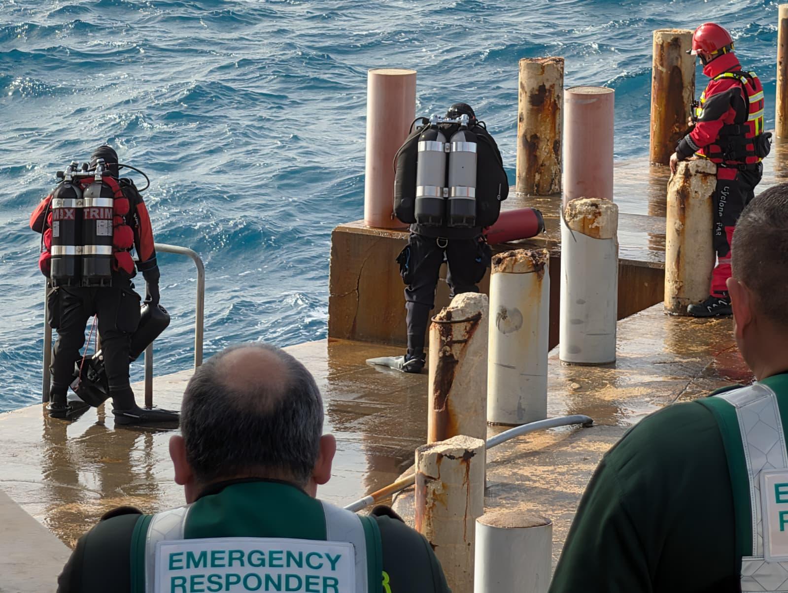 Divers eventually recovered the body. Photo: Chris Sant Fournier