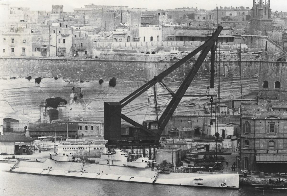 HMS XI, the &lsquo;Red crane&rsquo; and Senglea primary school under construction on St Michael&rsquo;s Bastion.