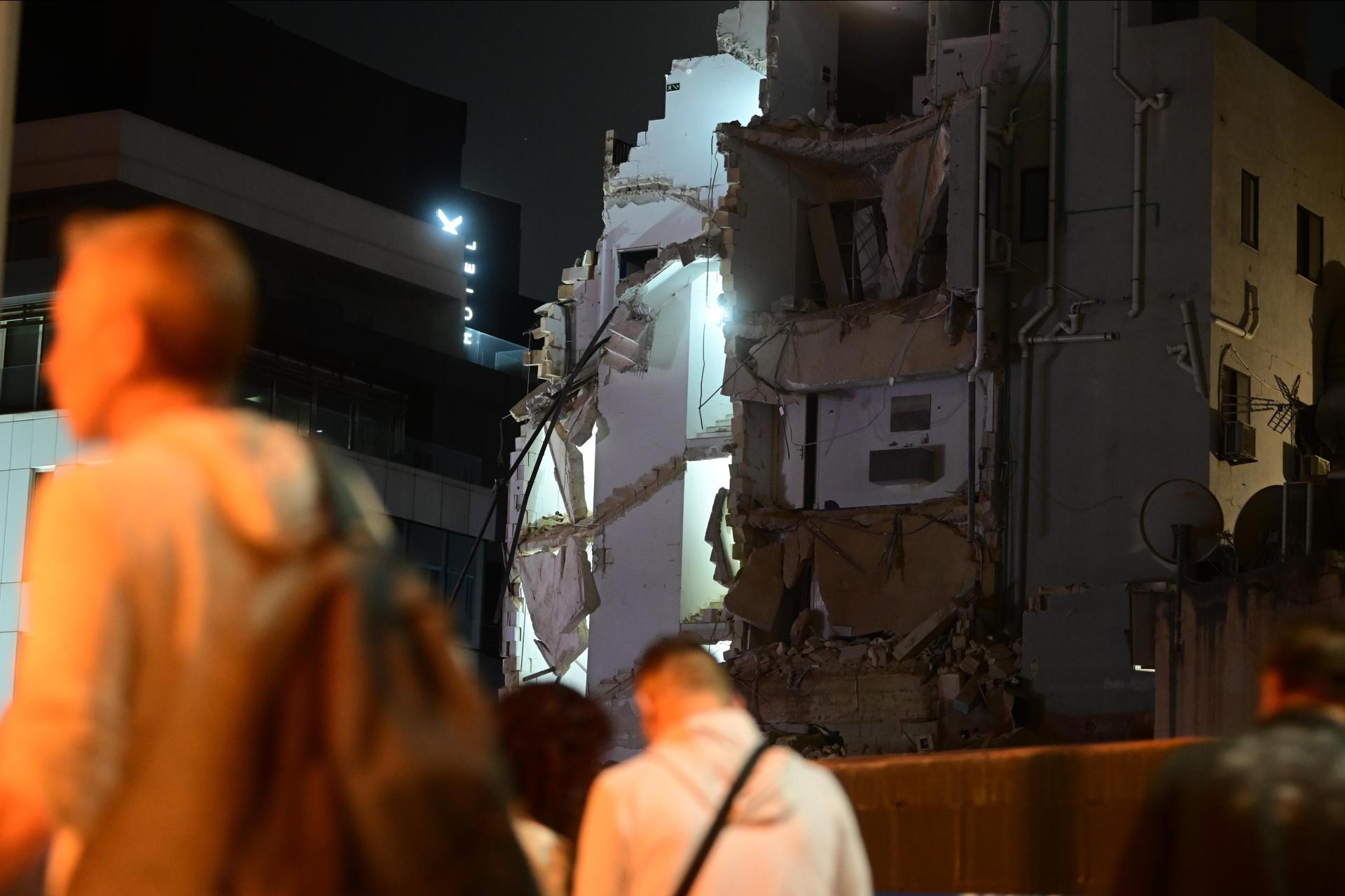 Bystanders at the site. Photo: Jonathan Borg
