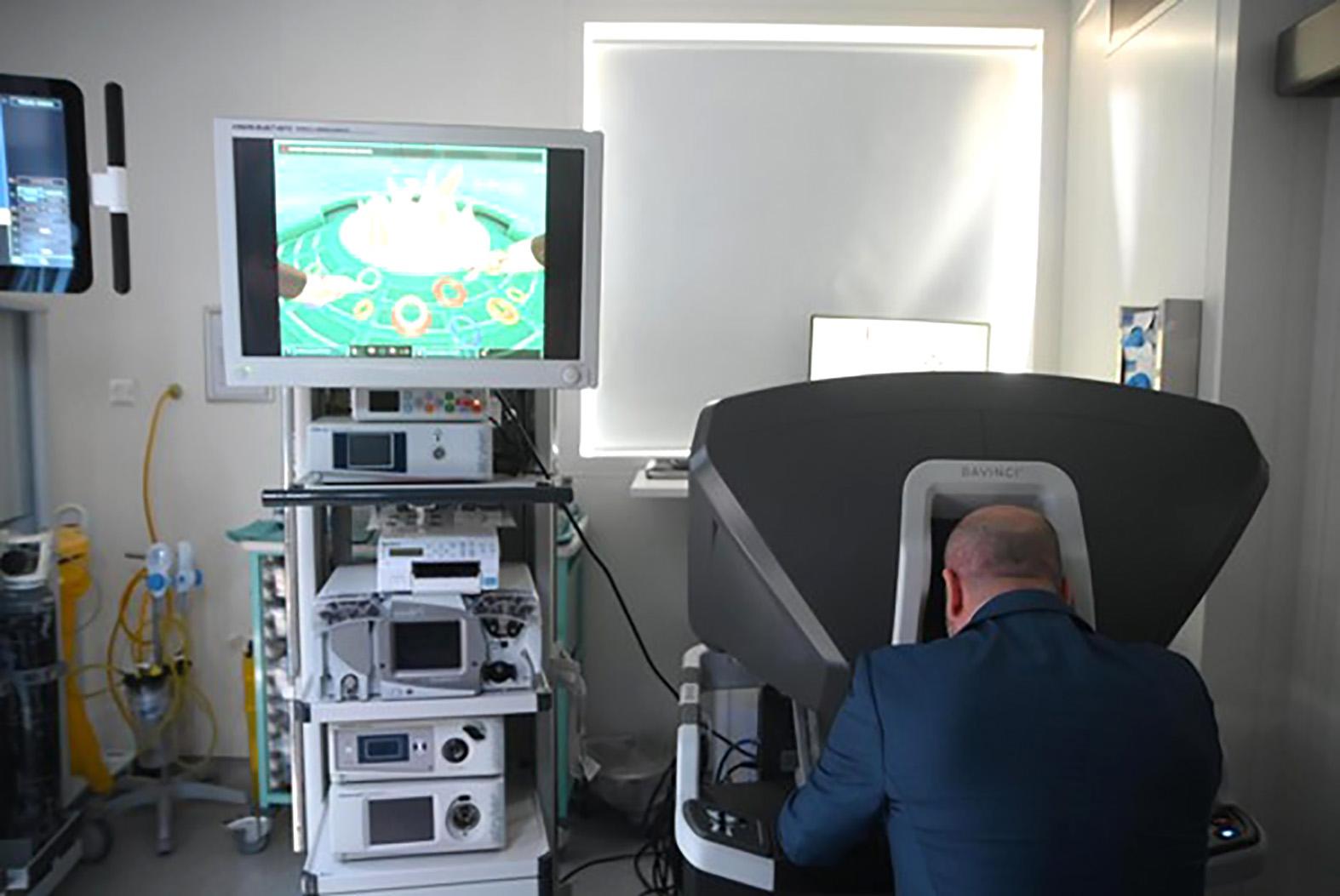 Camenzuli showing how surgeons use the machine. Photo: Jonathan Borg