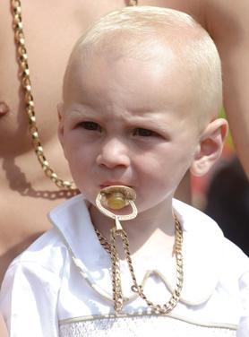 David Briganti, 18 months, from Gateshead, sucks on a &lsquo;golden&rsquo; dummy.