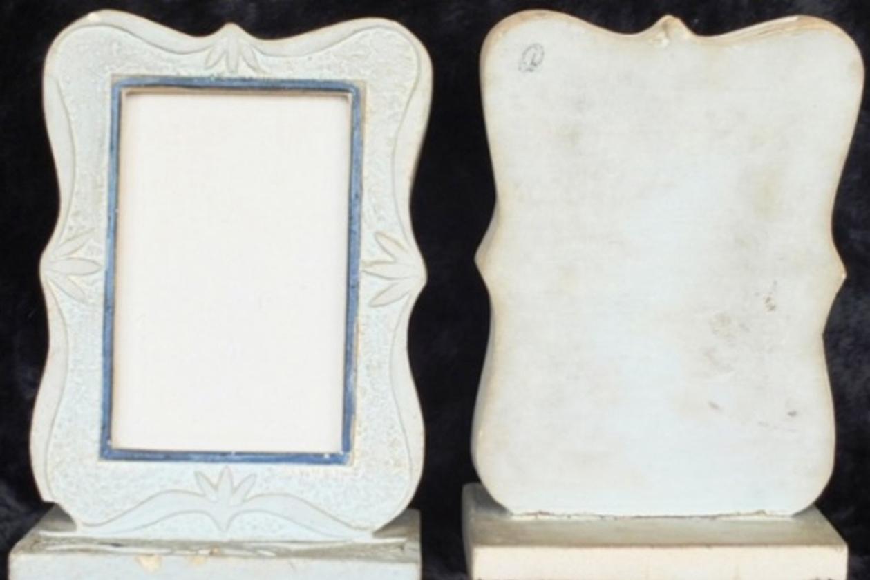 Front of the stone photo frame &ldquo;J&rdquo; and (right) the back of the stone picture frame marked &ldquo;L&rdquo;.