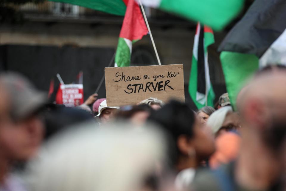 A demonstrator calls out UK PM Keir Starmer during a protest outside Downing Street. Photo: AFP.