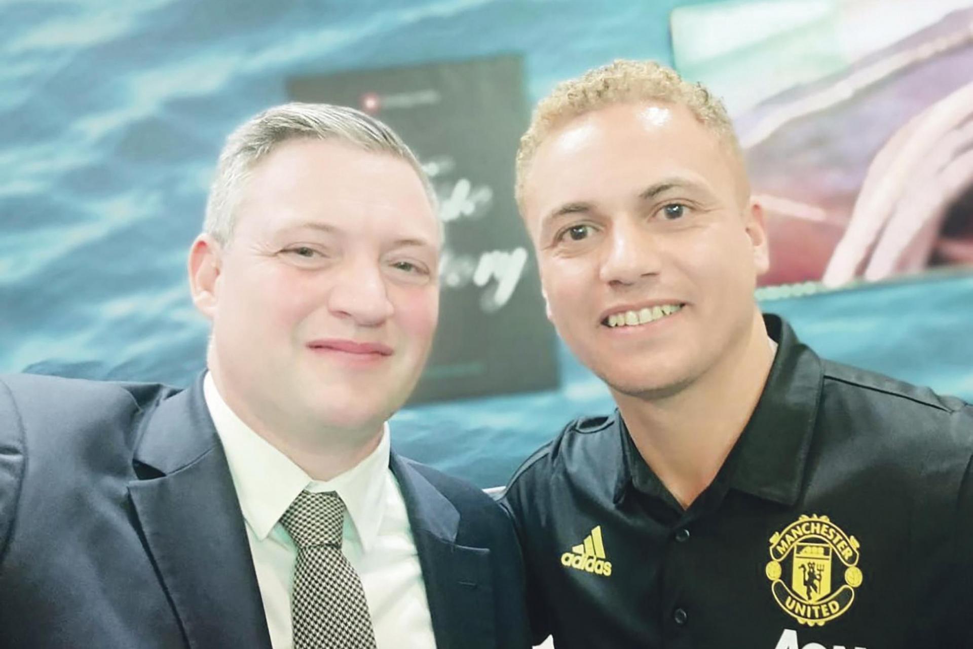 Tourism Minister Konrad Mizzi posing with Wes Brown, a former Manchester United defender, during a recent event.