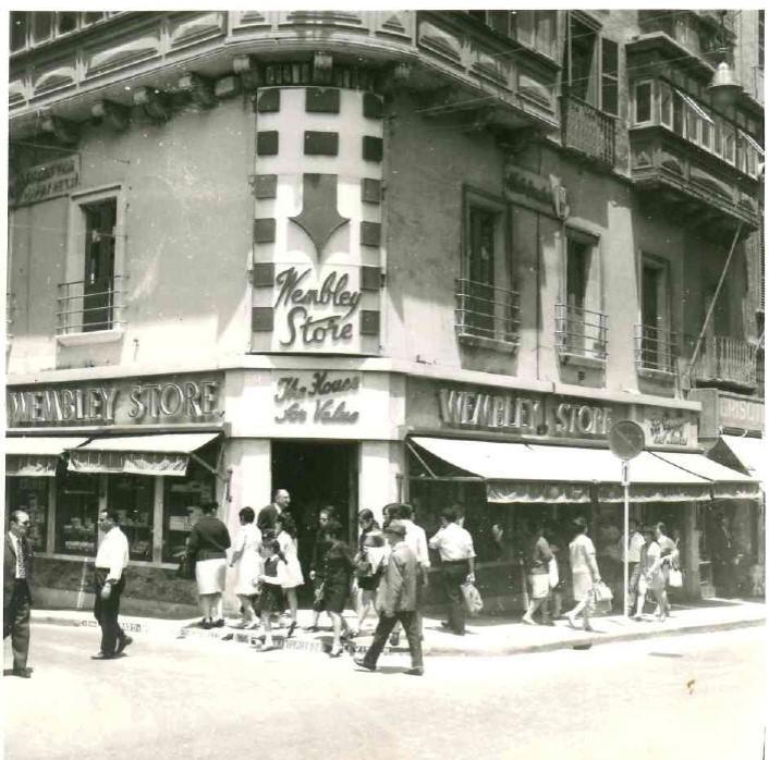 The iconic corner store with its symbolic red arrow sign.