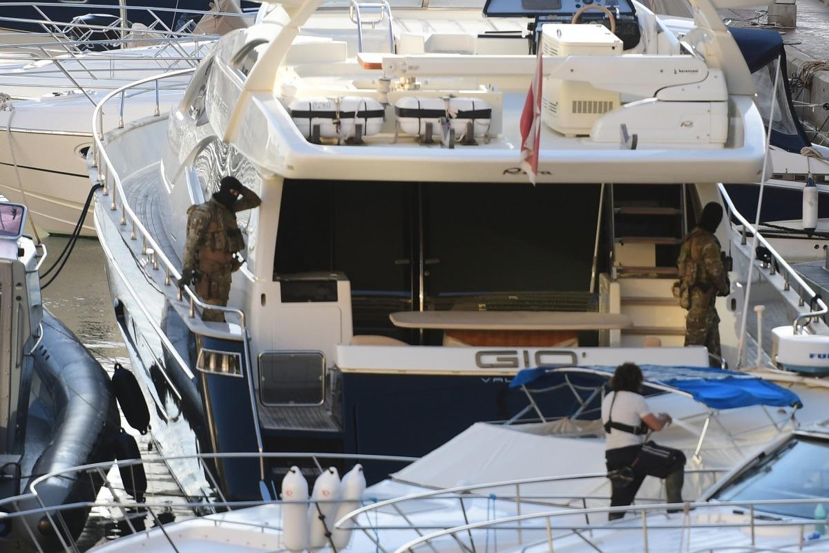 Soldiers on board Yorgen Fenech's boat, shortly after he tried to leave the country.