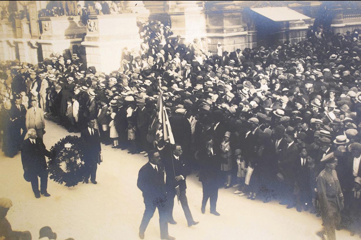 Mourners accompanying the coffin passing next to the Opera House.