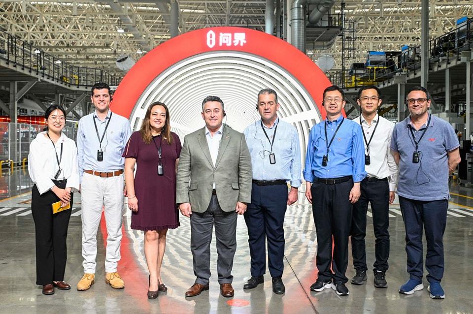 The PN delegation in China, with officials at a car factory manufacturing Huawei AITO cars. Photo: Facebook/Bernard Grech