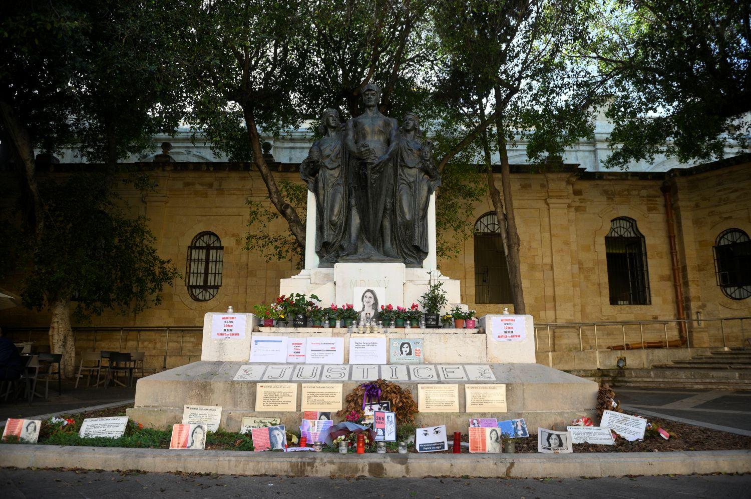 The temporary memorial to Caruana Galizia at the foot of the Great Siege monument.