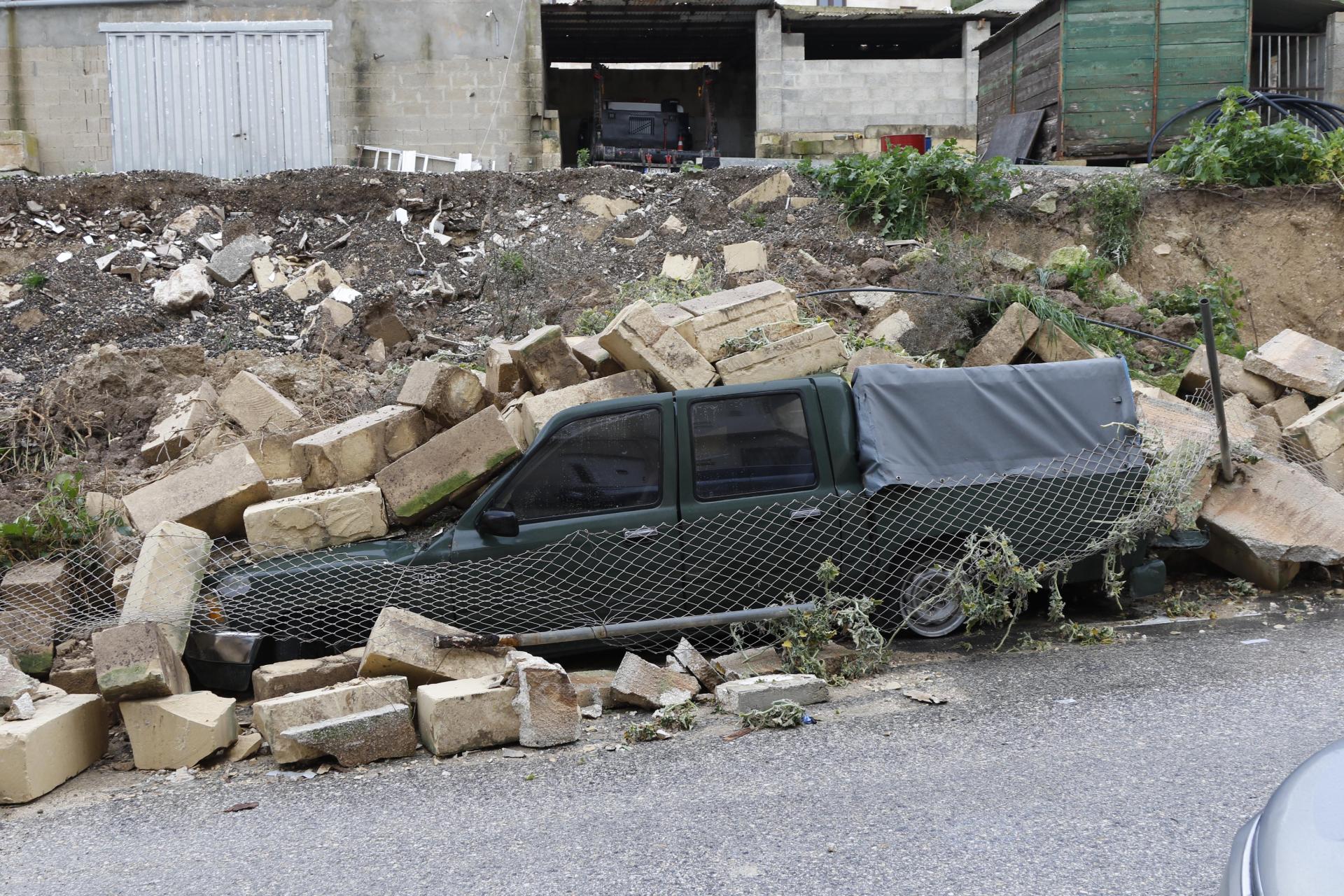 A boundary wall in St Paul's Bay left a pick-up truck buried beneath limestone bricks. Photo: Emanuel Busuttil