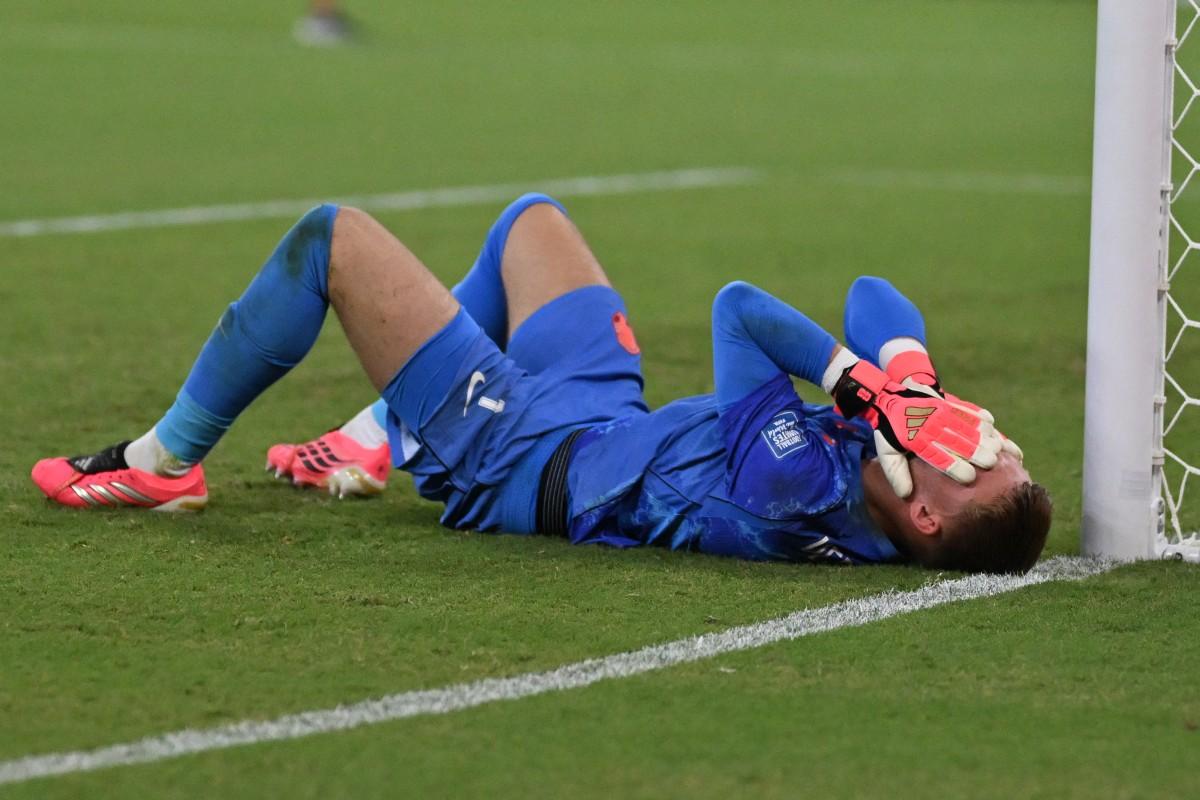 Netherlands' goalkeeper Bart Verbruggen reacts after losing in the shootout.