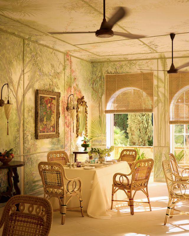 The dining room with garden plants painted on its walls. Photo: Boz Gagovski