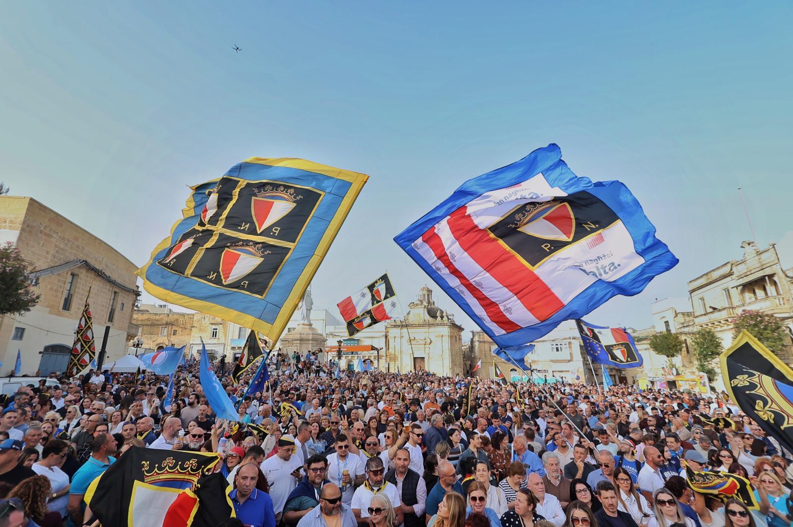 Despite PN changing its logo, many flags bearing the old emblem were still on show. Photo: Jonathan Borg