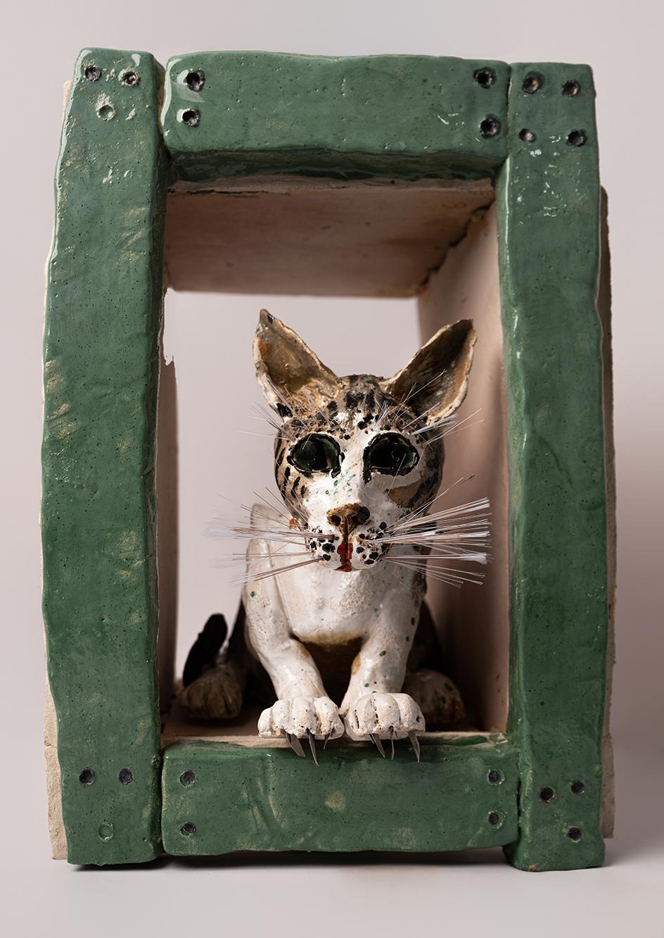 <em>Cat looking from window</em>