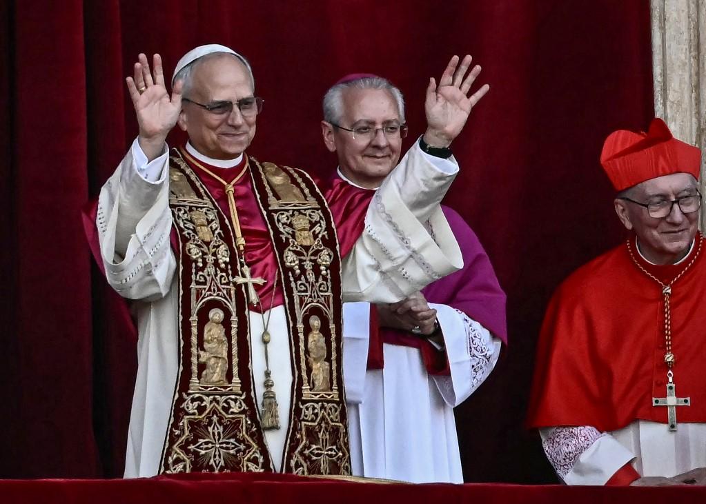 Newly elected Pope Leo XIV, Robert Prevost, gestures as he arrives on the main central loggia balcony of the St Peter's Basilica for the first time, after the cardinals ended the conclave, in The Vatican, on May 8. Photo: Filippo Monteforte / AFP