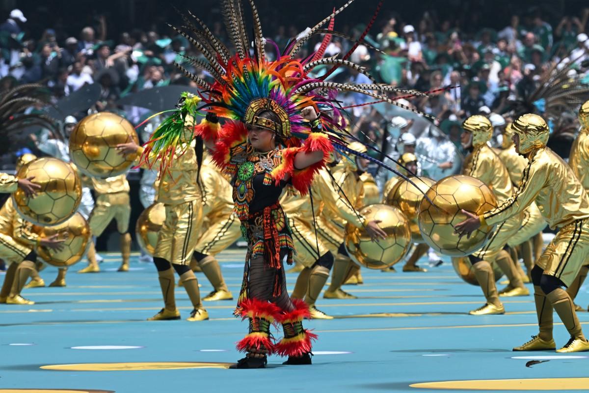 A performer in traditional costume at the opening ceremony in Mexico City. Photo: AFP