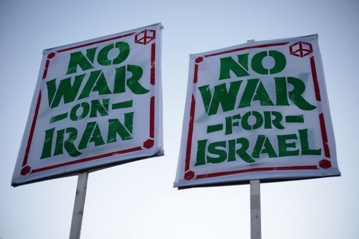 Anti-war demonstrators hold signs as they gather near the White House to protest the war in Iran on April 7, 2026 in Washington, DC. Photo: AFP