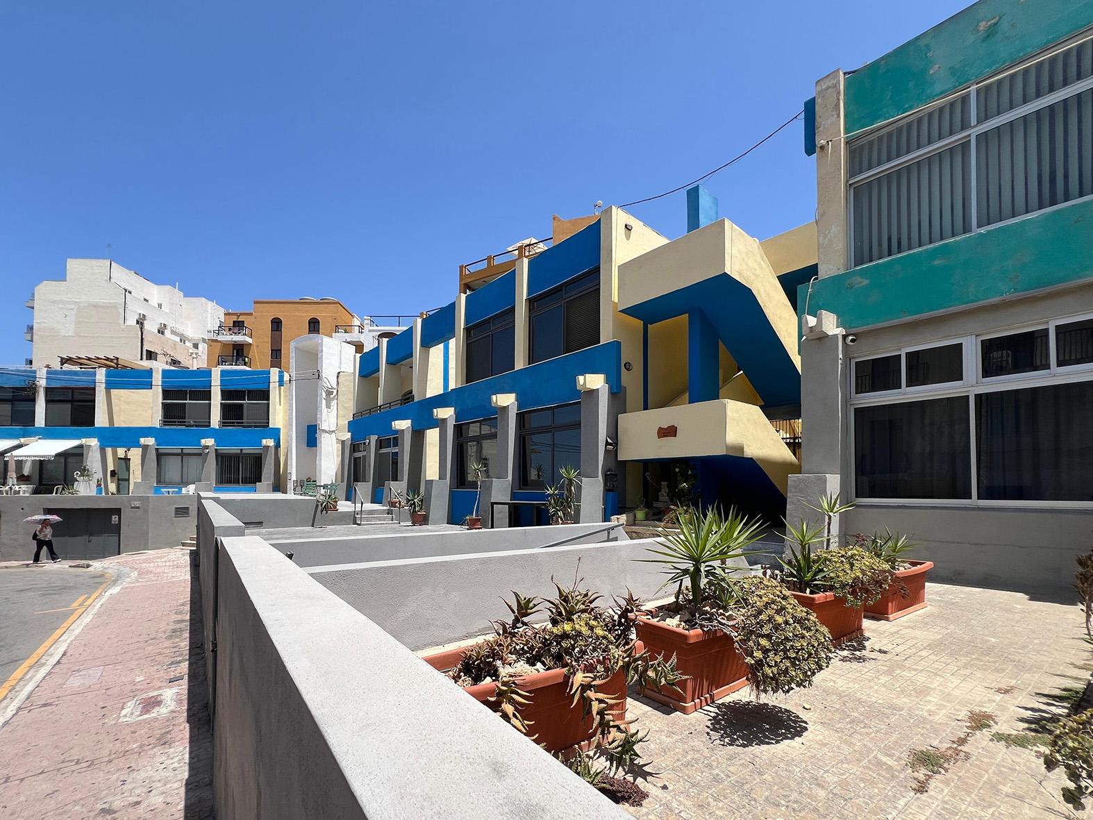 Residents fear that replacing the row of colourful properties with a sprawling development will erode their quality of life &ndash; and the area&rsquo;s tourist appeal. Photo: Chris Sant Fournier