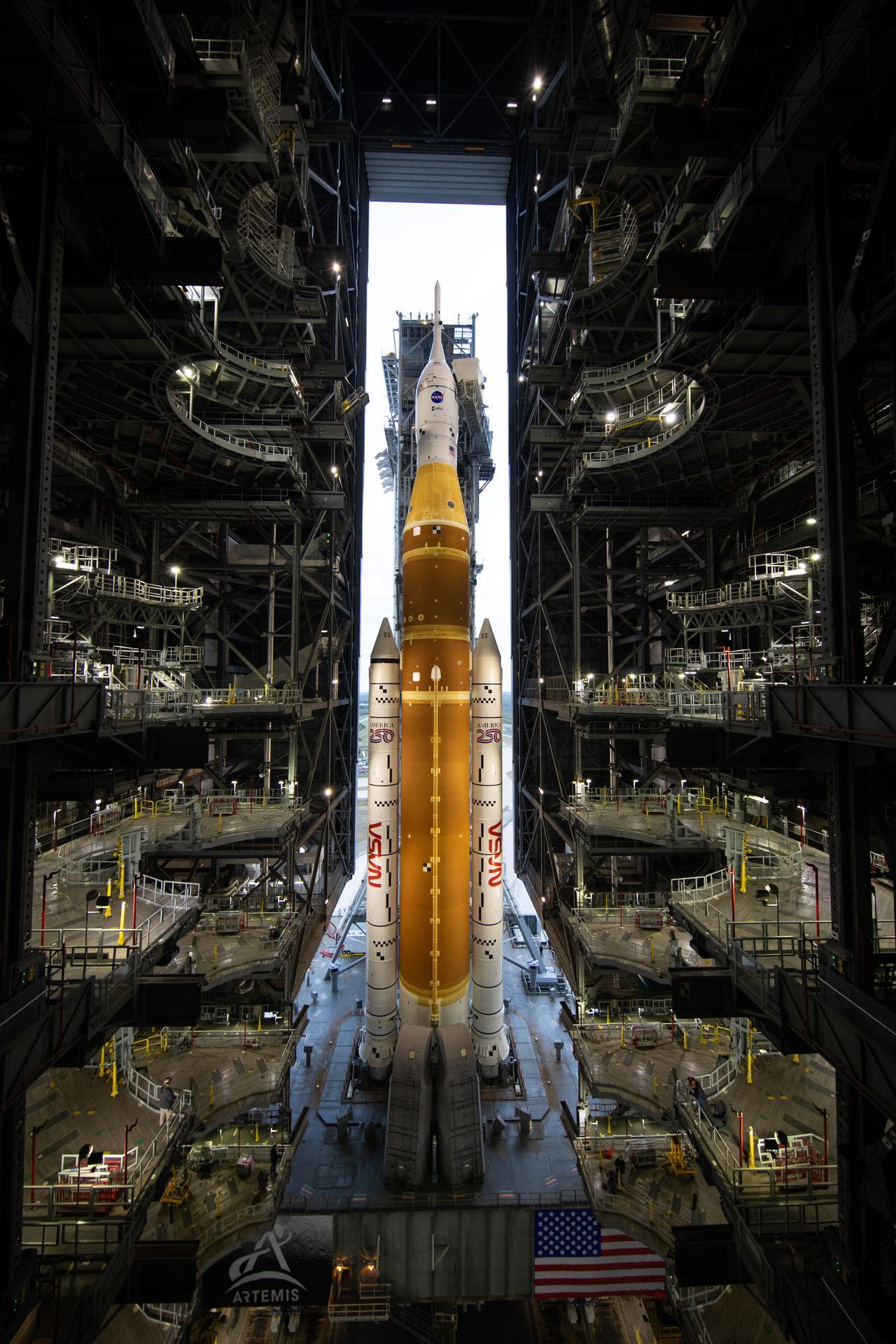 NASA&rsquo;s Space Launch System (SLS) rocket and Orion spacecraft, secured to the mobile launcher, is seen as it rolls out of the Vehicle Assembly Building at the Kennedy Space Center in Florida. Photo: NASA