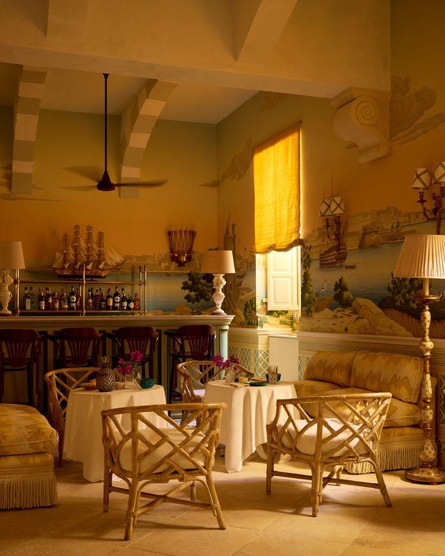 The Valletta Bar at Casa Bonavita, where wallcoverings depicting scenes of the capital took a year of create as experts studied stone samples and climate conditions before painting the &ldquo;capriccio&rdquo;. Photo: Boz Gagovski