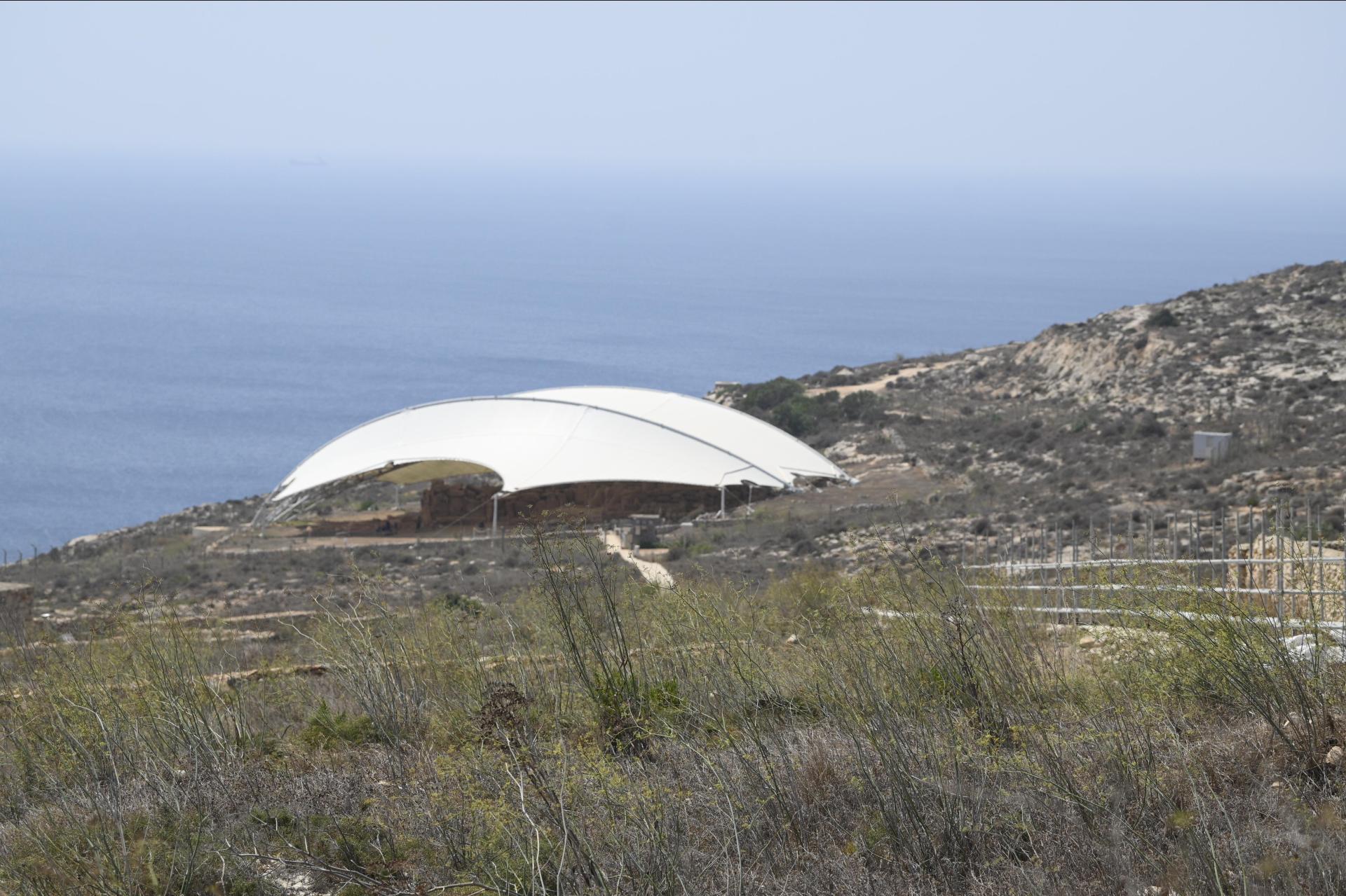 A protective shelter covers Ħaġar Qim to slow down the weathering of the ancient stonework. File photo: Times of Malta