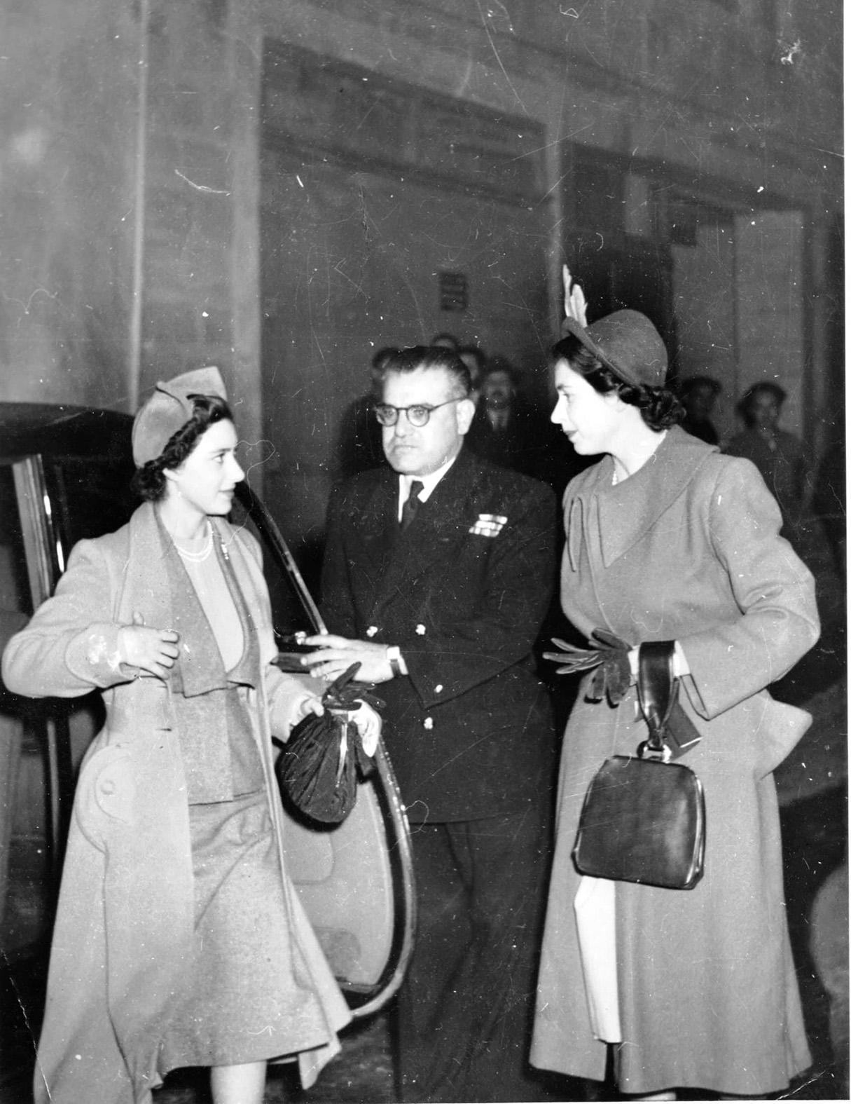 Giuseppe Micallef (middle) opening the car door for Princess Margaret (left) with Princess Elizabeth (right) standing next to him.