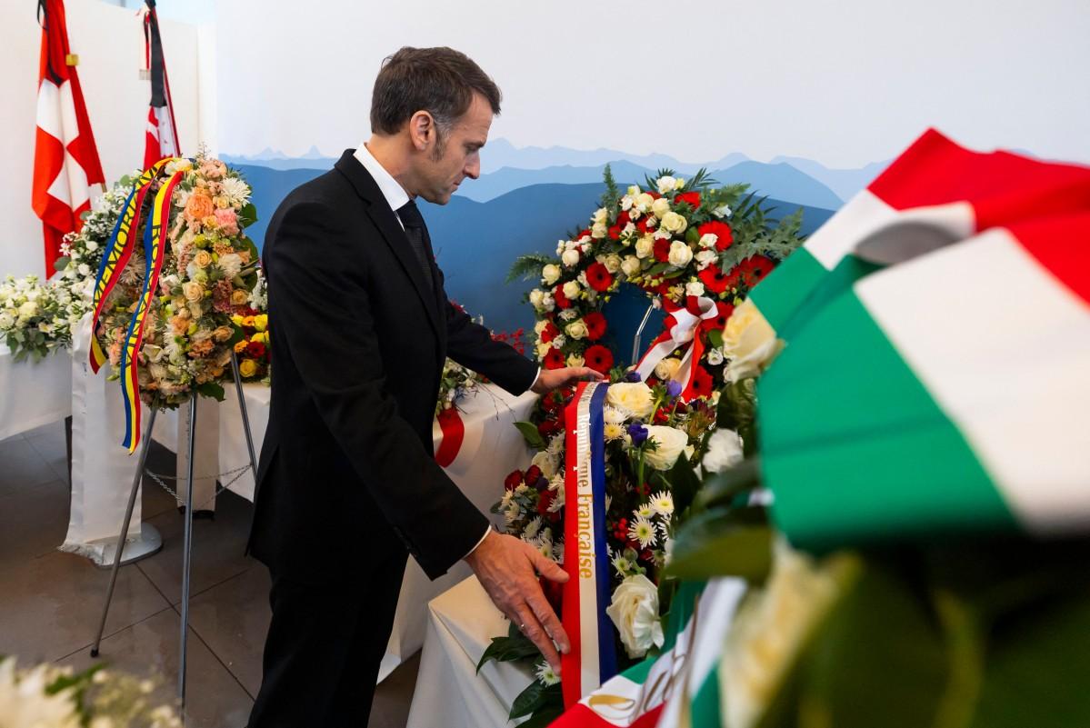 France's President Emmanuel Macron lays a floral wreath prior to a tribute ceremony for the victims, eight of whom were French. Photo: AFP